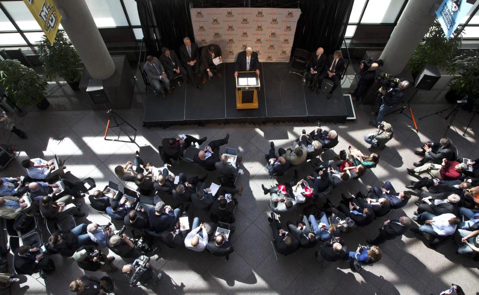 Milwaukee Bucks owner Herb Kohl, seated second from right on stage, listens as investment firm executive Wesley Edens speaks at a news conference Wednesday, April 16, 2014, in Milwaukee. Kohl has reached a deal to sell the NBA basketball franchise to Edens and Marc Lasry for about $550 million.The deal is subject to approval by the NBA and its Board of Governors. (AP Photo/Morry Gash)