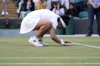 Tunisia's Ons Jabeur celebrates defeating Belgium's Elise Mertens during a fourth round women's singles match on day seven of the Wimbledon tennis championships in London, Sunday, July 3, 2022. (AP Photo/Alberto Pezzali)