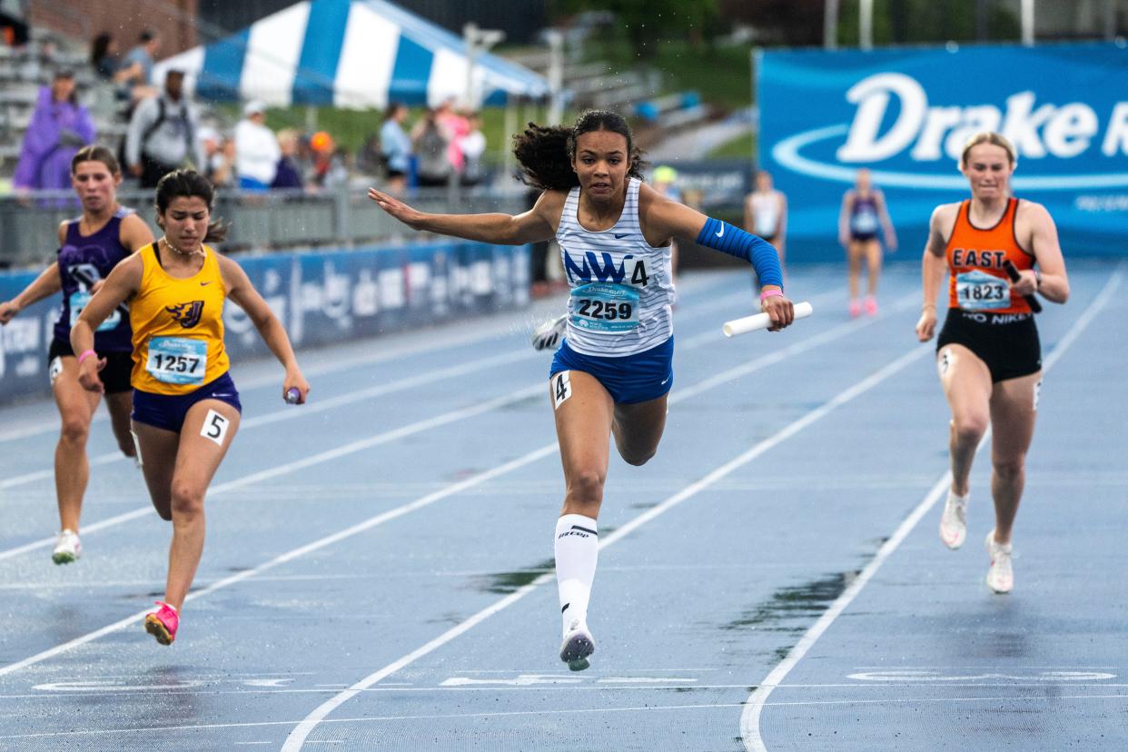 Waukee Northwest's Keziah Caldwell runs in the 4x100 meter relay during the Drake Relays at Drake Stadium on Saturday, April 27, 2024, in Des Moines.