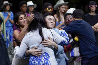 FILE - The 'We Are Made in Italy (WAMI)' collective celebrate on stage at the end of the Stella Jean women's Spring Summer 2023 collection presented in Milan, Italy, on Sept. 23, 2022. Along with Stella Jean, the WAMI collective is withdrawing from this Month's Fashion Week, which they were to open with a digital presentation. (AP Photo/Alberto Pezzali, File)