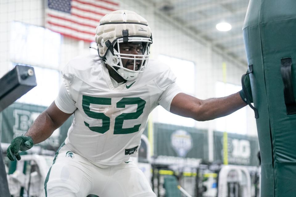 Tunmise Adeleye works out during Michigan State football's spring practices in East Lansing in April.
