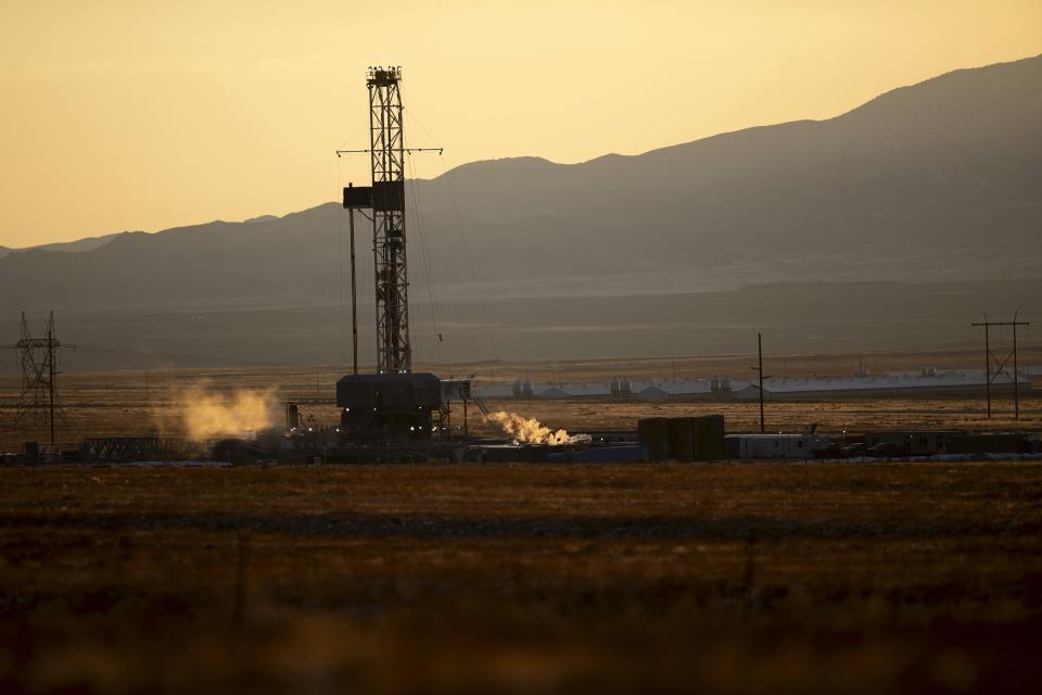 A drill rig stands at a Fervo Energy geothermal site near Milford, Utah, Sunday, Nov. 26, 2023. In Nevada, Fervo Energy's first operational project has begun pumping carbon-free electricity onto that state's electric grid to power Google data centers, Google announced Tuesday, Nov. 28. That pilot will help Fervo launch projects like this one in Utah to deliver far more carbon-free electricity to the grid. (AP Photo/Ellen Schmidt)