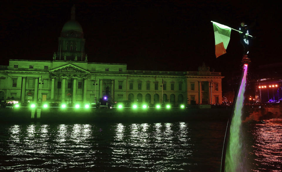 <p>Members of Flyboard Ireland take part in the Liffey Lights Moment – Matinee in Dublin’s city centre as part of the city’s New Year’s eve celebrations, Sunday Dec. 31, 2017. (Photo: Brian Lawless/AP) </p>