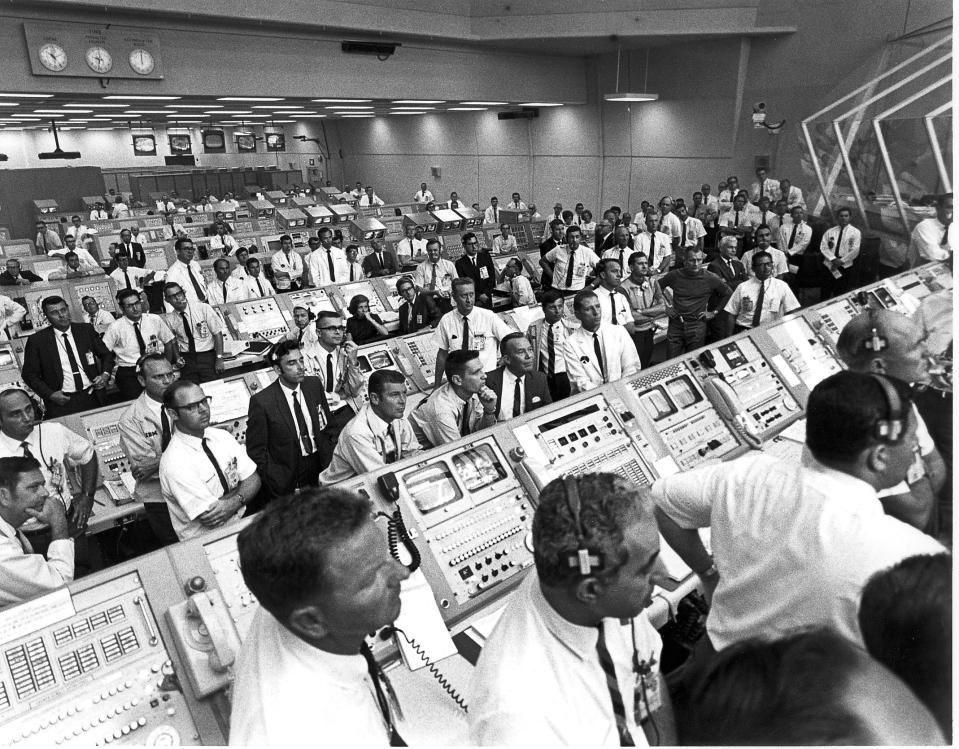 Members of the Kennedy Space Center control room team rise from their consoles to see the liftoff of the Apollo 11 mission on July 16, 1969.  (Photo: NASA/AFP/Getty Images)