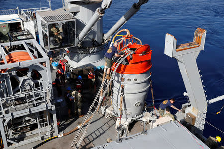 U.S. and Turkish sailors prepare a U.S. Navy Submarine Rescue Chamber to dive on board the Turkish Navy's submarine rescue mother ship TCG Alemdar during the Dynamic Monarch-17, a NATO-sponsored submarine escape and rescue exercise, off the Turkish Naval base of Aksaz, Turkey, September 20, 2017. REUTERS/Murad Sezer