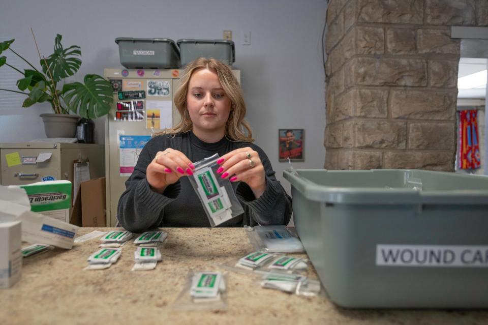 Kyle Meltzer, prevention services coodinator for Access Point Pueblo, puts together wound care kits that will be distributed to clients on Tuesday, April 16, 2024.