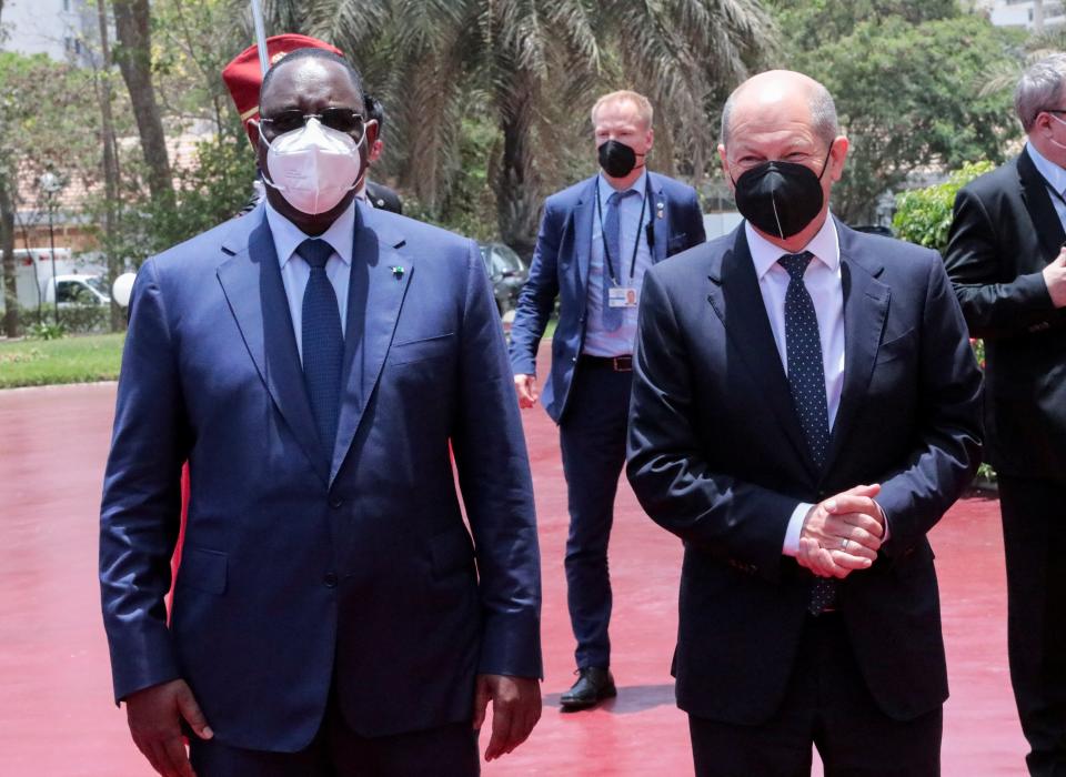 Sall receives Scholz at the presidential palace in Dakar (Reuters)