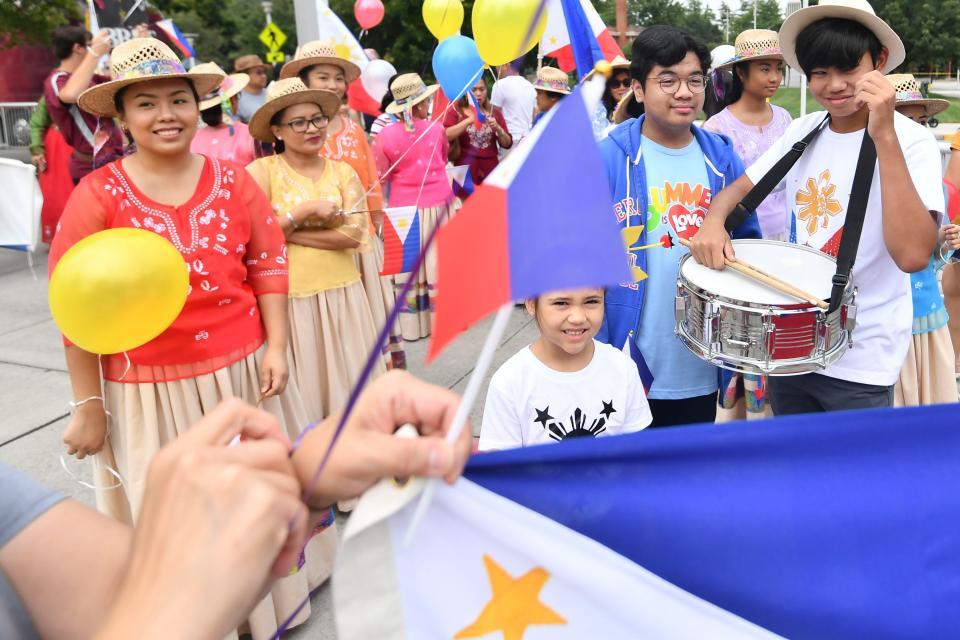 Representative for the Philippines prepare to parade through World's Fair Park on Sunday, August 25, 2019 to mark the start of Knox Asian Fest. 