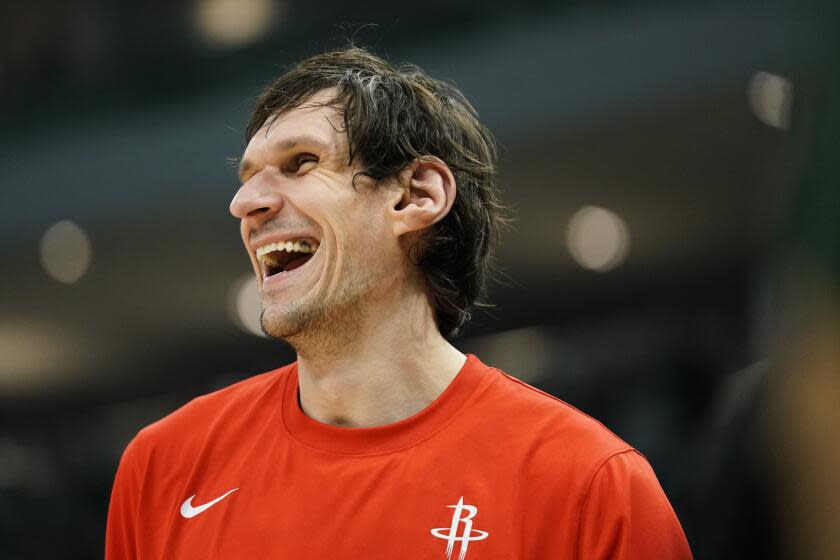 Houston Rockets' Boban Marjanovic laughs while warming up before an NBA basketball game.