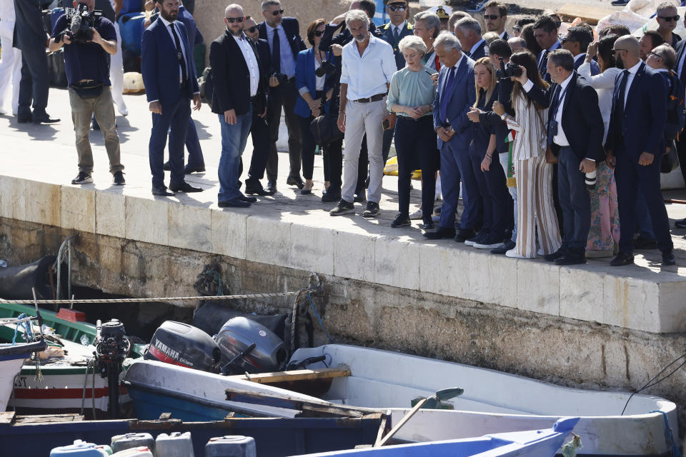 The President of the European Commission, Ursula von der Leyen, sixth from right front row, and the Italy's Premier Giorgia Meloni, fourth from right front row, visit the island of Lampedusa, in Italy, Sunday, Sept. 17, 2023. EU Commission President Ursula von der Leyen and Italian Premier Giorgia Meloni on Sunday toured a migrant center on Italy’s southernmost island of Lampedusa that was overwhelmed with nearly 7,000 arrivals in a 24-hour period this week. (Cecilia Fabiano/LaPresse via AP)