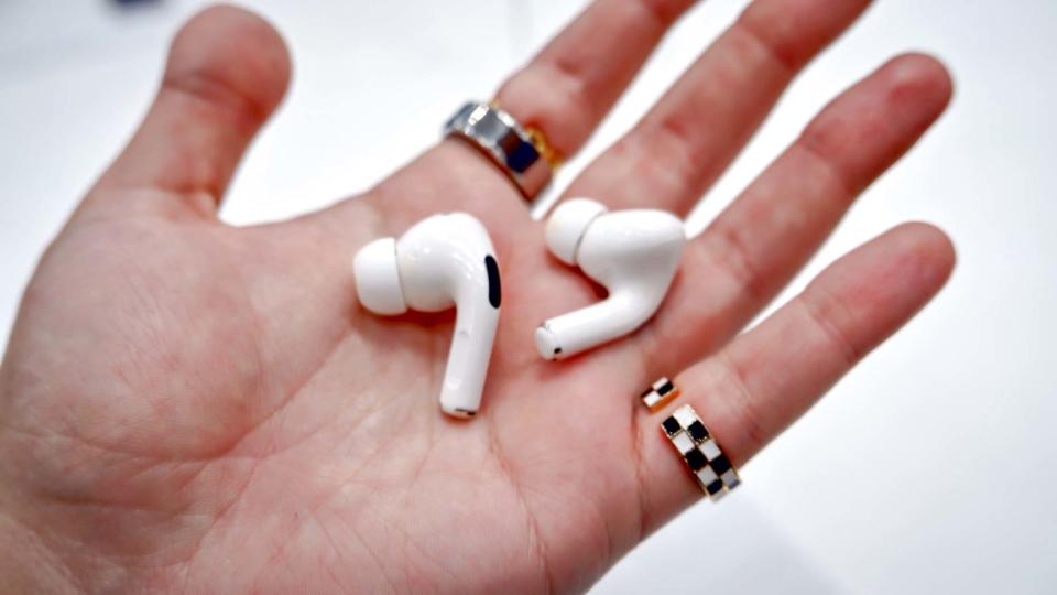 AirPods Pro 2 held in hand