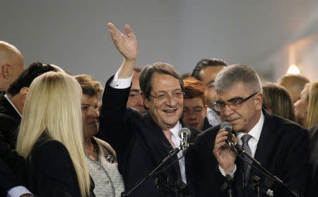 Newly elected president Nicos Anastasiades greets his supporters during a proclamation ceremony after the second round of the presidential election, at Eleftheria Hall in Nicosia, Cyprus, February 4, 2018. REUTERS/Yiannis Kourtoglou