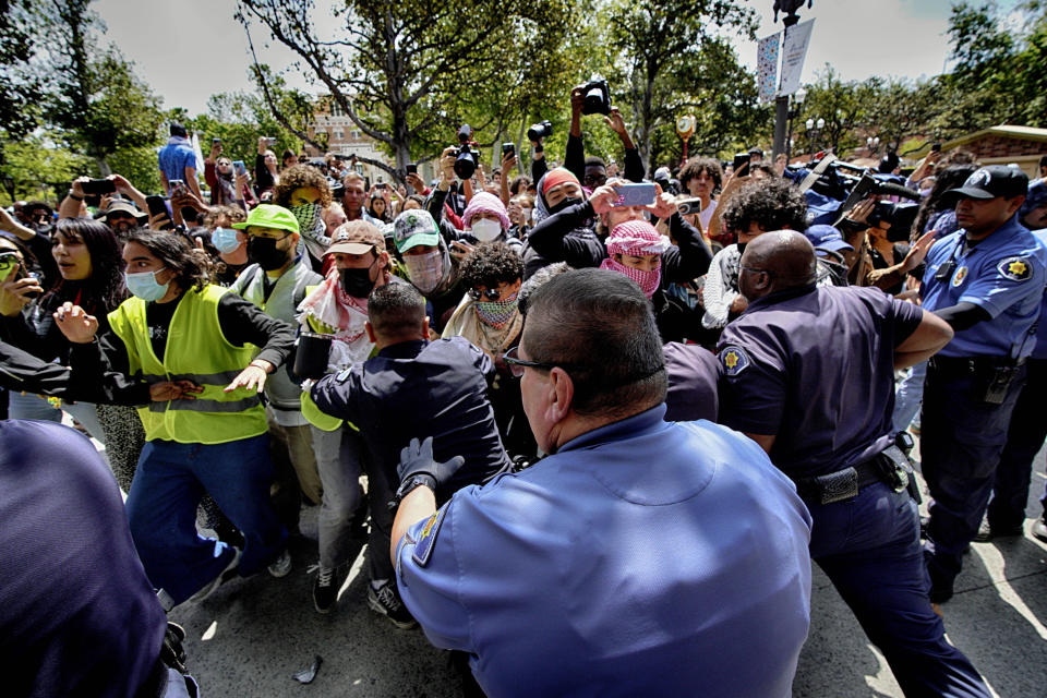 University of Southern California protesters push and shove University Public Safety officers as tempers get heated during a pro-Palestinian occupation on the University of Southern California campus Wednesday, April 24, 2024 in Los Angeles. (AP Photo/Richard Vogel)