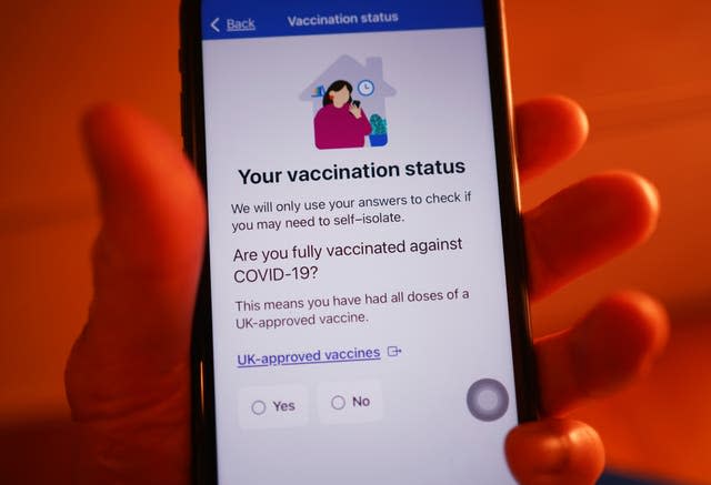 Questions asked by the NHS coronavirus contact tracing app to determine whether self-isolation is required  (Yui Mok/PA)