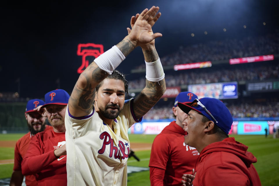 Philadelphia Phillies' Nick Castellanos celebrates after the Phillies won Game 2 of a baseball NL Division Series against the New York Mets, Sunday, Oct. 6, 2024, in Philadelphia. (AP Photo/Matt Slocum)