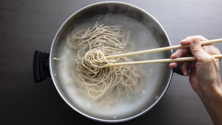 soba noodles boiling in pot