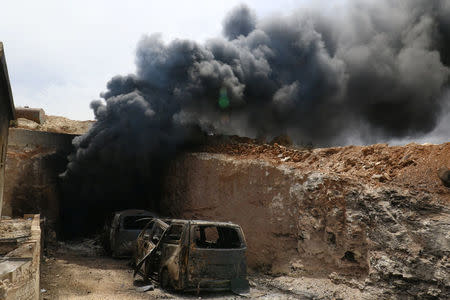 Smoke rises from an emergency service point after an airstrike at the rebel-held village of Maar Zita in Idlib province, Syria April 27, 2017. REUTERS/Ammar Abdullah