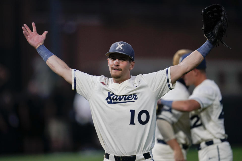 Xavier center fielder Garrett Schultz (10) celebrates after his team's win over Vanderbilt in an NCAA college baseball tournament regional elimination game Sunday, June 4, 2023, in Nashville, Tenn. (AP Photo/George Walker IV)