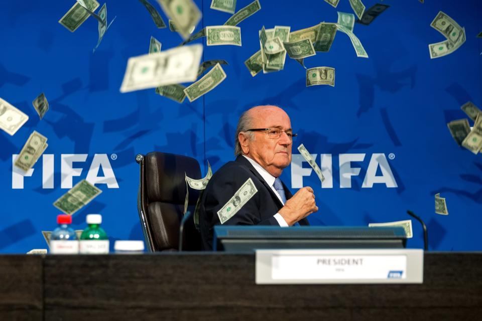 ZURICH, SWITZERLAND - JULY 20: A comedian attacked FIFA President Joseph S. Blatter with money during a press conference at the Extraordinary FIFA Executive Committee Meeting at the FIFA headquarters on July 20, 2015 in Zurich, Switzerland. (Photo by Philipp Schmidli/Getty Images)