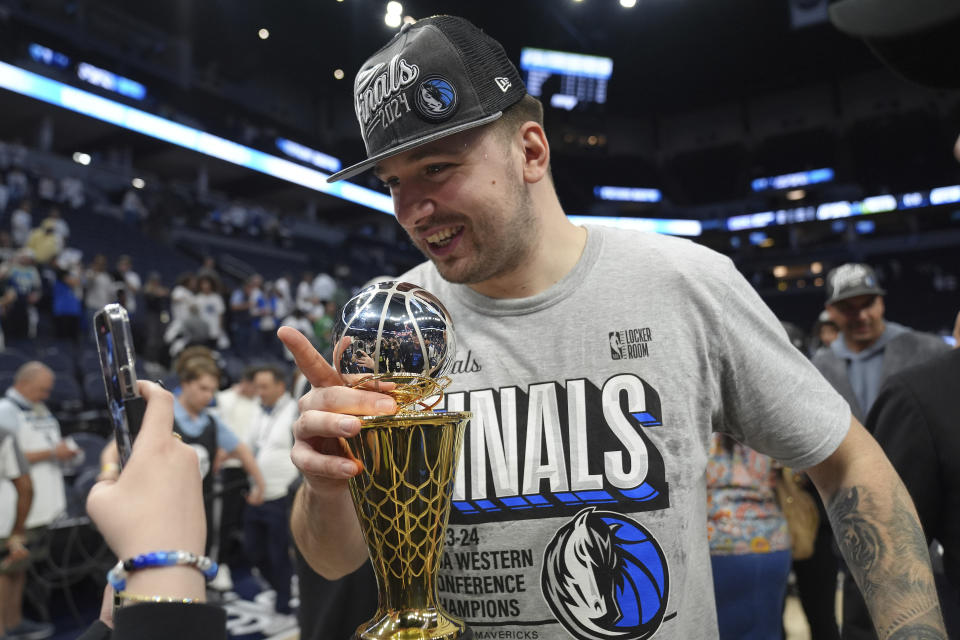 Dallas Mavericks guard Luka Doncic celebrates after the team's victory over the Minnesota Timberwolves in Game 5 of the Western Conference Finals of the NBA basketball playoffs on Thursday, May 30, 2024, in Minneapolis.  The Mavericks won 124-103, taking the series 4-1 and advancing to the NBA Finals.  (AP Photo/Abbie Parr)