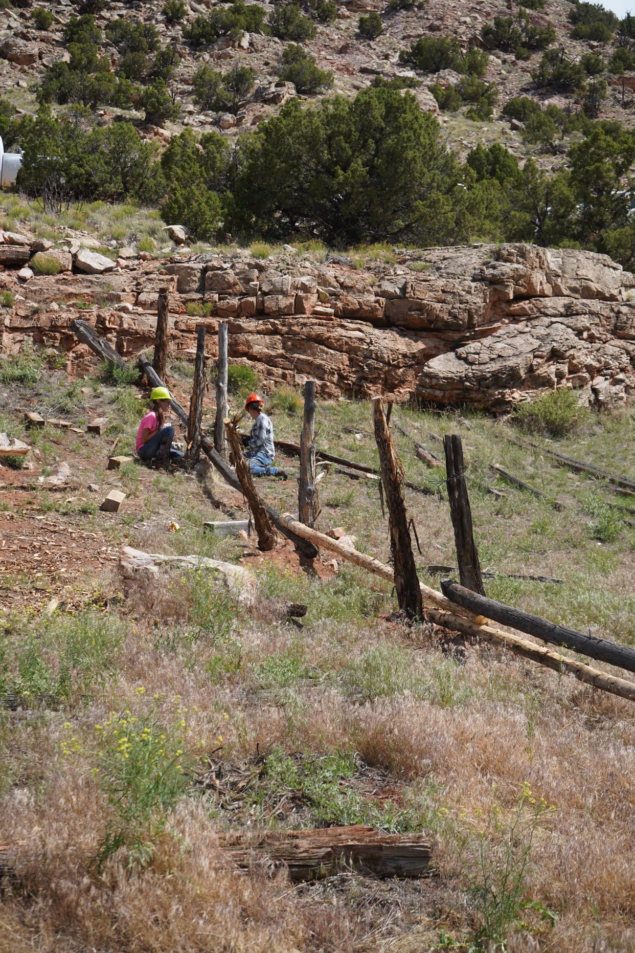 Youth Conservation Corps work on a fence at Bighorn Canyon National Recreation Area.