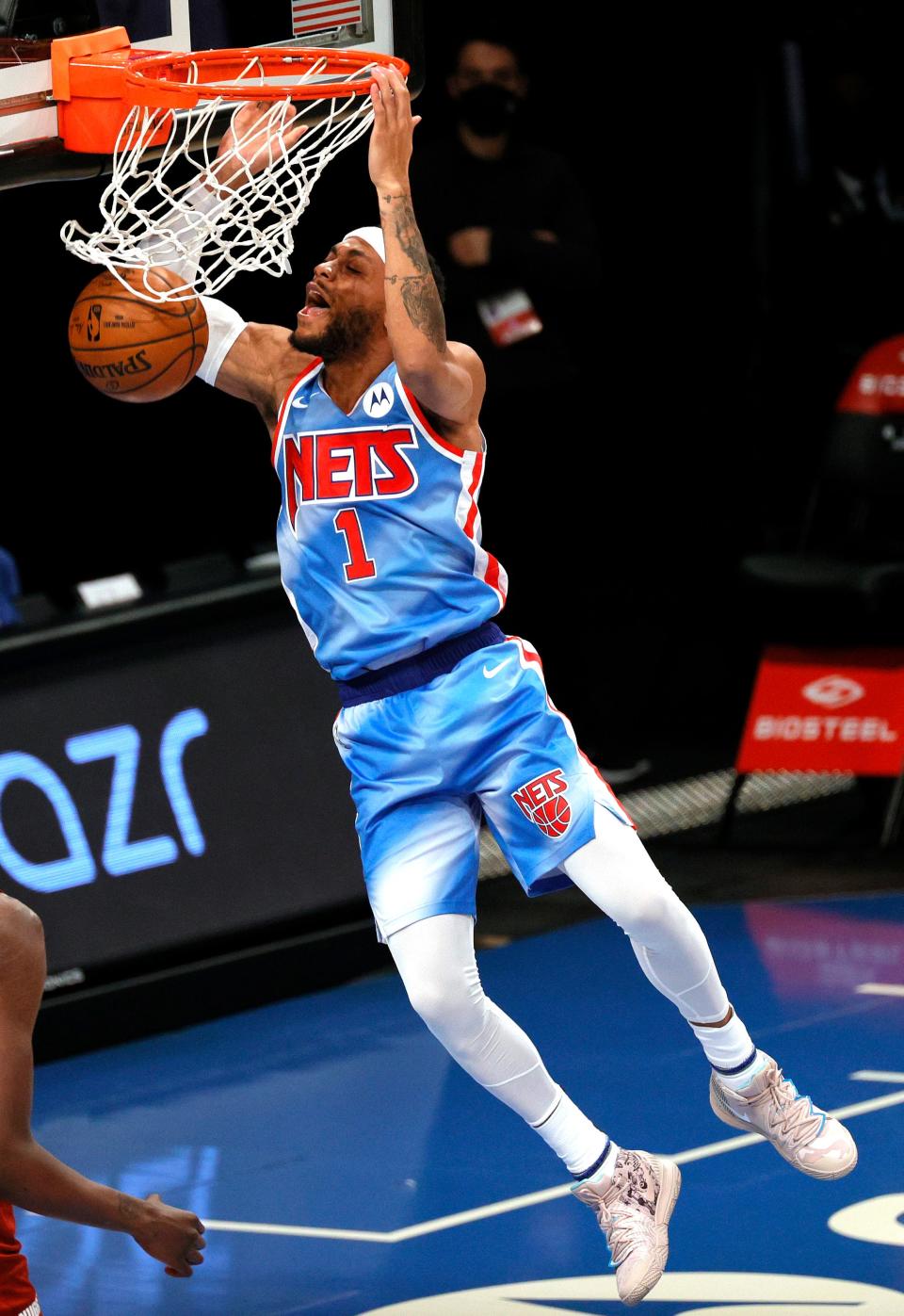 Brooklyn Nets' Bruce Brown dunks against the Denver Nuggets at Barclays Center on January 12, 2021 in Brooklyn.