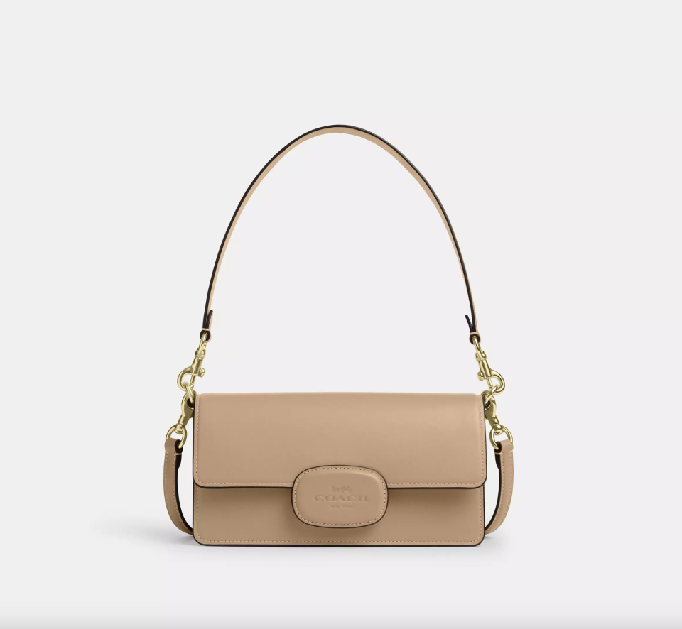 Eliza Flap Crossbody with Leather Covered Closure in tan leather (Photo via Coach Outlet)