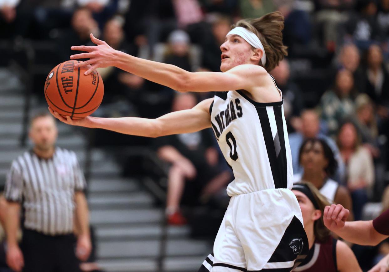 West Ottawa's Nash Bosman goes up for a shot against Grandville on Friday.