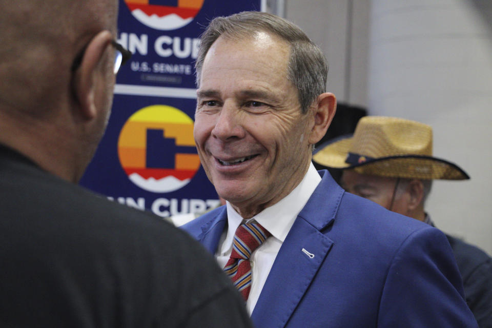 U.S. Rep. John Curtis, a candidate for the U.S. Senate seat Mitt Romney is vacating, speaks to delegates at the Utah Republican Party Convention, April 27, 2024, at the Salt Palace Convention Center in Salt Lake City, Utah. (AP Photo/Hannah Schoenbaum)