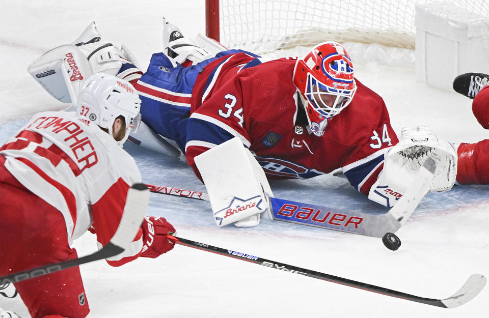 Montreal Canadiens goaltender Jake Allen stops Detroit Red Wings' J.T. Compher during the third period of an NHL hockey game, Saturday, Dec. 2, 2023 in Montreal. (Graham Hughes/The Canadian Press via AP)