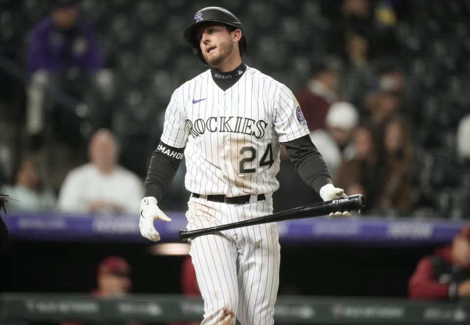 Colorado Rockies' Ryan McMahon reacts after striking out against Arizona Diamondbacks relief pitcher Joe Mantiply during the ninth inning of a baseball game Friday, April 28, 2023, in Denver. (AP Photo/David Zalubowski)