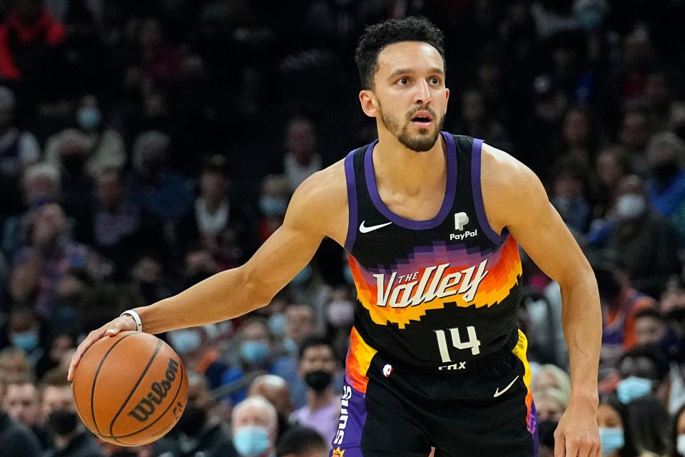 Phoenix Suns guard Landry Shamet (14) during the second half of an NBA basketball game against the Oklahoma City Thunder, Thursday, Dec. 23, 2021, in Phoenix.