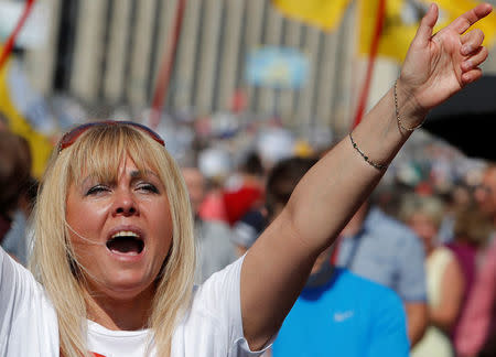 A woman attends a protest over government's decision to increase the retirement age in Moscow, Russia, July 29, 2018. REUTERS/Sergei Karpukhin