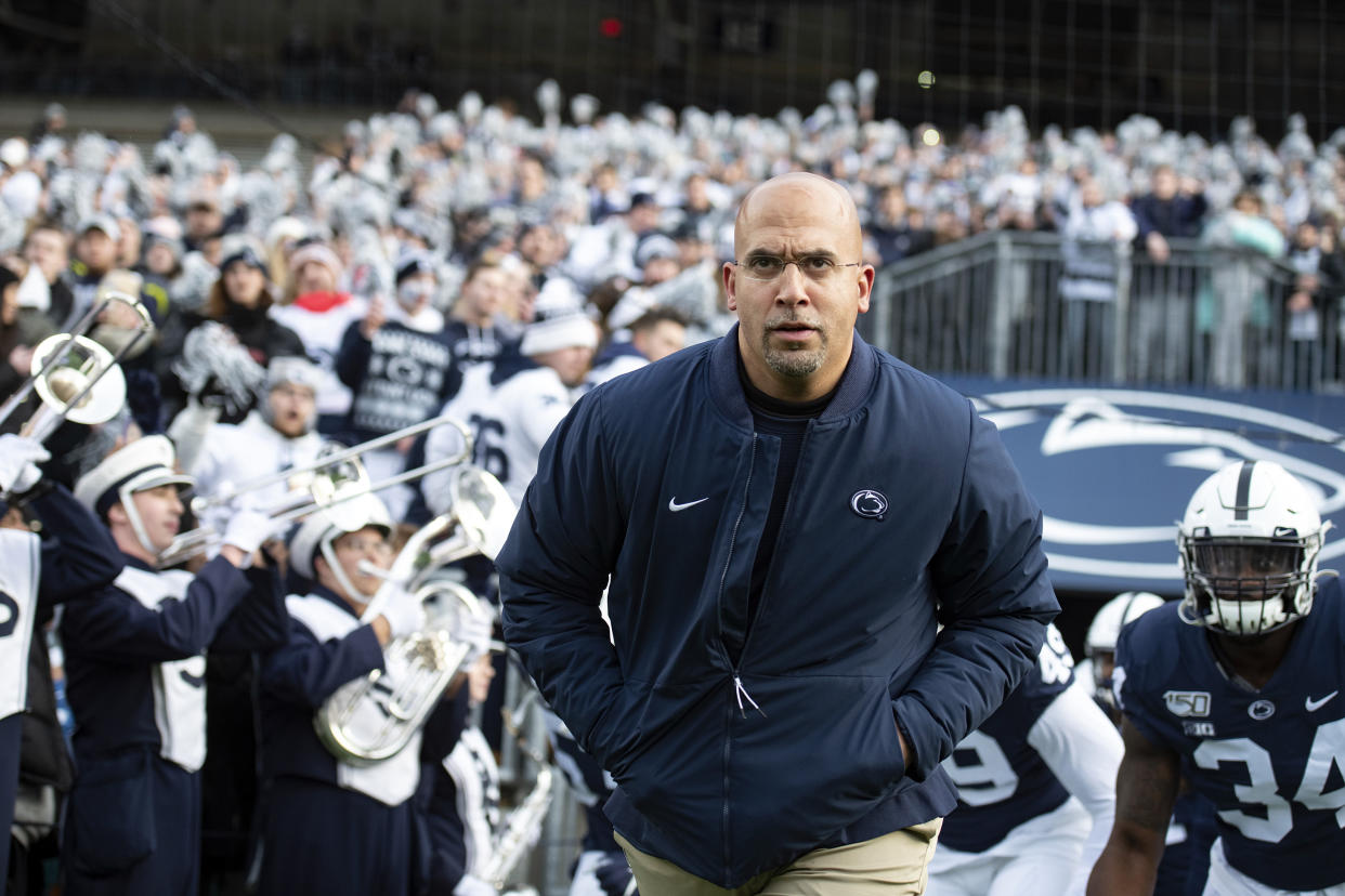 FILE - In this Nov. 30, 2019, file photo, Penn State head coach James Franklin leads his team onto the field for an NCAA college football game against Rutgers in State College, Pa. Penn State faces Wisconsin on Saturday as they open their college football season. (AP Photo/Barry Reeger, File)