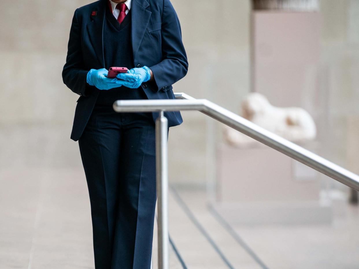 A museum employee wearing a protective glove is seen at The Metropolitan Museum of Art in New York City: Getty Images