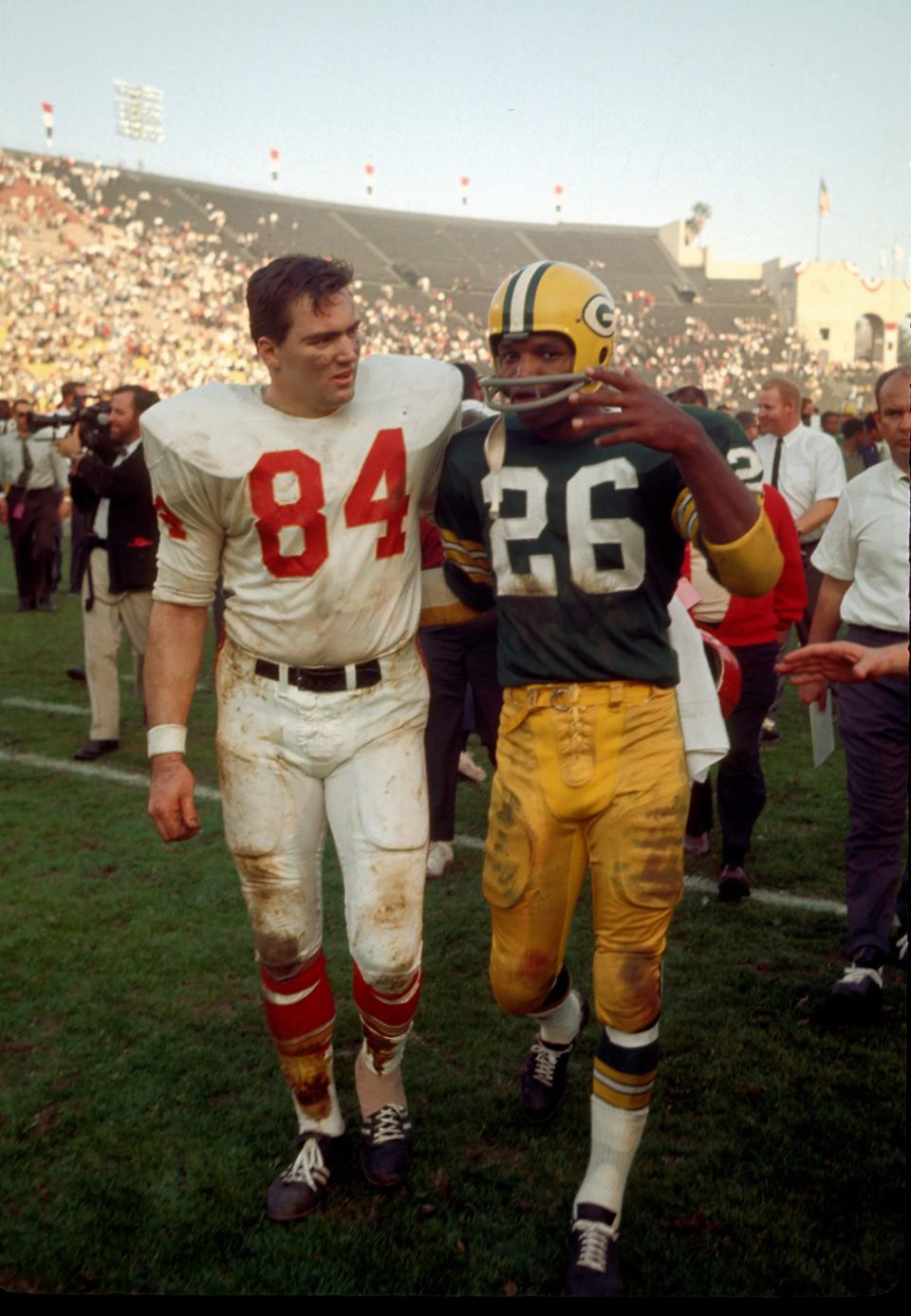 Jan. 15, 1967 in Los Angeles: Kansas City Chiefs tight end Fred Arbanas (84) and Green Bay Packers defensive back Herb Adderley (26) leave the field after the Packers defeated the Chiefs 35-10 in Super Bowl I at the Los Angeles Coliseum.