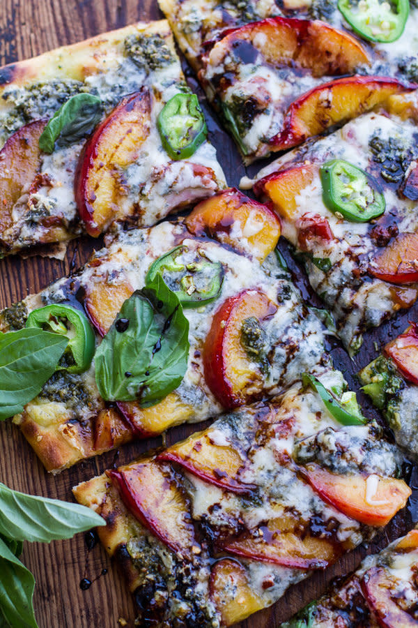 <strong>Get the <a href="http://www.halfbakedharvest.com/toasted-walnut-pesto-caramelized-nectarine-pizza-wspicy-balsamic-drizzle/" target="_blank">Toasted Walnut Pesto and Caramelized Nectarine Pizza  recipe</a> from Half Baked Harvest</strong>