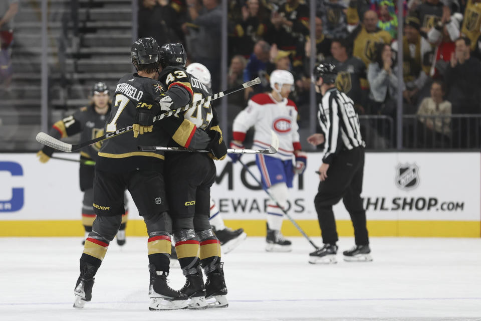 Vegas Golden Knights defenseman Alex Pietrangelo (7) hugs center Paul Cotter (43) after Cotter's goal against the Montreal Canadiens during the first period of an NHL hockey game Monday, Oct. 30, 2023, in Las Vegas. (AP Photo/Ian Maule)