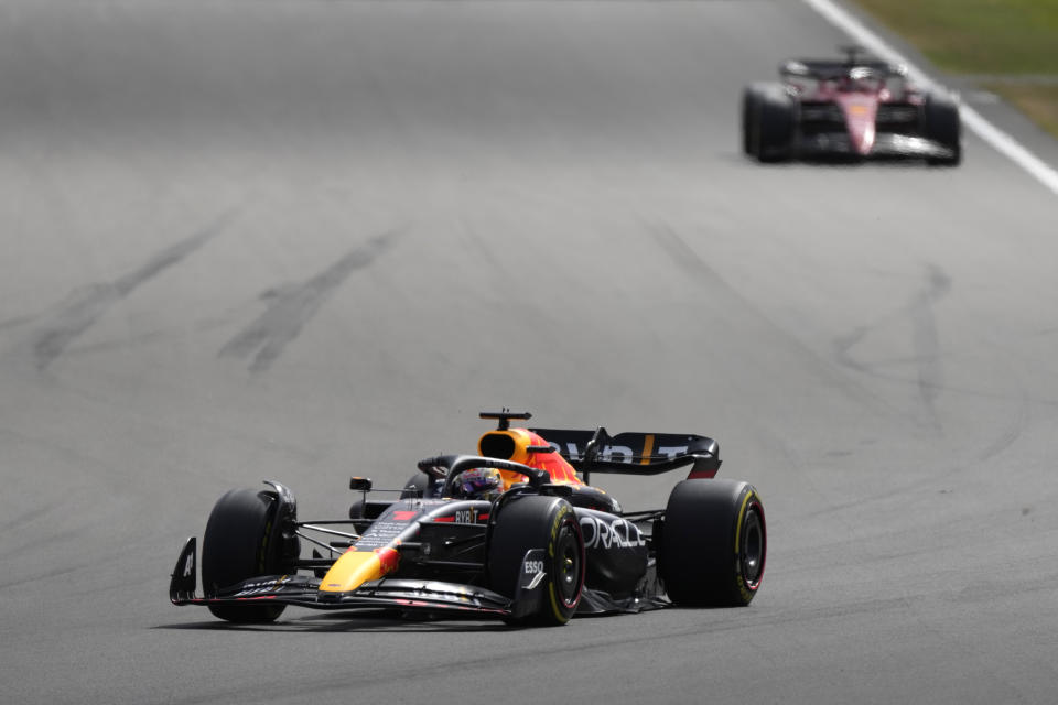 Red Bull driver Max Verstappen of the Netherlands steers his car follows by Ferrari driver Charles Leclerc of Monaco during the British Formula One Grand Prix at the Silverstone circuit, in Silverstone, England, Sunday, July 3, 2022. (AP Photo/Frank Augstein)