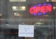 A convenience store on Queen Street West advertises a couple hard to come by items. The Province of Ontario held a 1 pm emergency sitting of the legislator to pass COVID-19 legislation. Just 24 MPPs from all parties will be on hand so they can maintain social distancing in the house. in Toronto. March 19, 2020. (Steve Russell/Toronto Star via Getty Images)