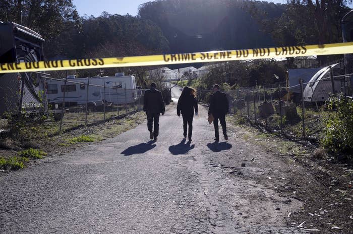 FBI officials walk towards the crime scene at California Terra Garden, formerly the Mountain Mushroom Farm, on Jan. 24.