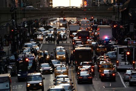 FILE PHOTO: Traffic is pictured at twilight along 42nd St. in the Manhattan borough of New York, U.S., March 27, 2019. REUTERS/Carlo Allegri/File Photo
