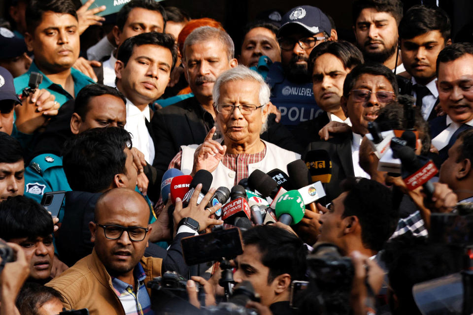 Bangladeshi Nobel peace laureate Professor Muhammad Yunus gestures in front of the court after being sentenced for six months of imprisonment, in Dhaka (Mohammad Ponir Hossain / Reuters)