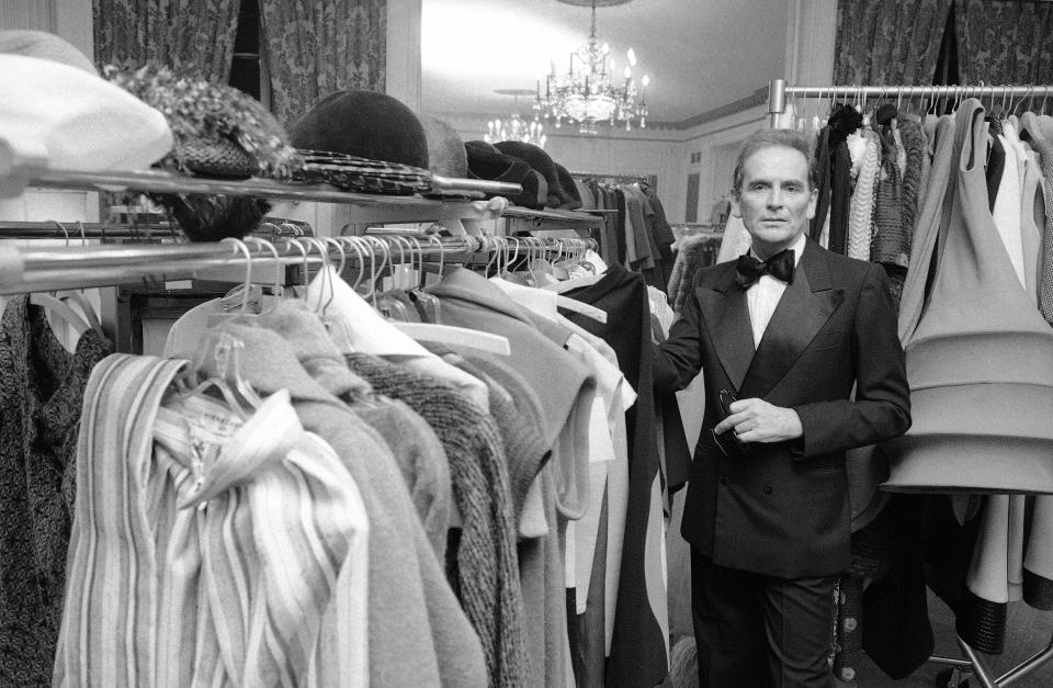 FILE - In this Oct.30 1975 file photo, French designer Pierre Cardin poses in the dressing room at Hotel Pierre in New York. France's Academy of Fine Arts says famed fashion designer Pierre Cardin has died at 98 (AP Photo/Ray Stubblebine, File)