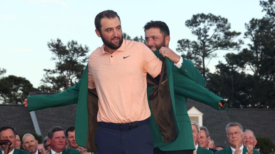 <div>AUGUSTA, GEORGIA - APRIL 14: Scottie Scheffler of the United States is awarded the Green Jacket by 2023 Masters champion Jon Rahm of Spain during the Green Jacket Ceremony after Scheffler won the 2024 Masters Tournament at Augusta National Golf Club on April 14, 2024 in Augusta, Georgia. (Photo by Jamie Squire/Getty Images)</div>