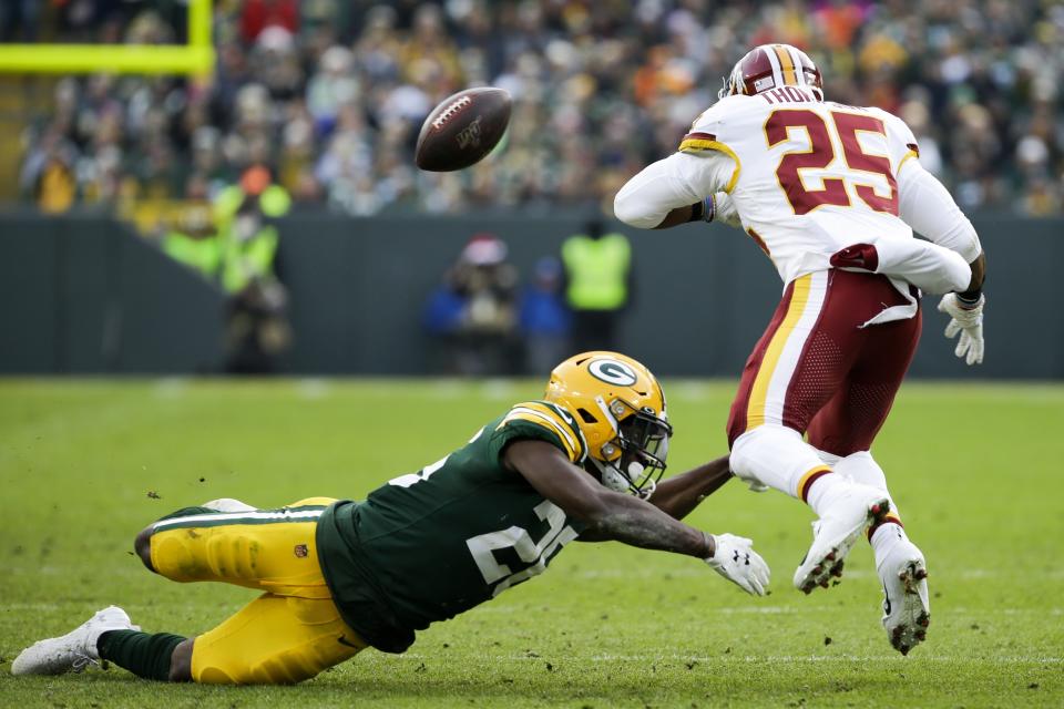 Washington Redskins' Chris Thompson fumbles as he is hit by Green Bay Packers' Darnell Savage during the second half of an NFL football game Sunday, Dec. 8, 2019, in Green Bay, Wis. The Redskins recovered the fumble. (AP Photo/Mike Roemer)