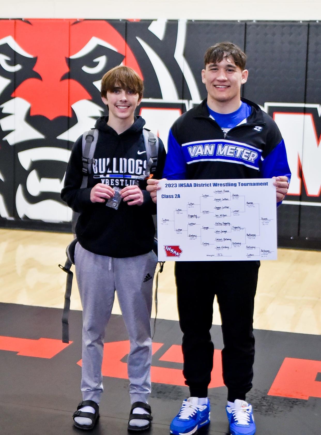 Van Meter's Quinn Arellano and Jackson Boese pose for a photo after qualifying for the state tournament during a Class 2A district meet on Saturday, Feb. 11, 2023, in Adel.