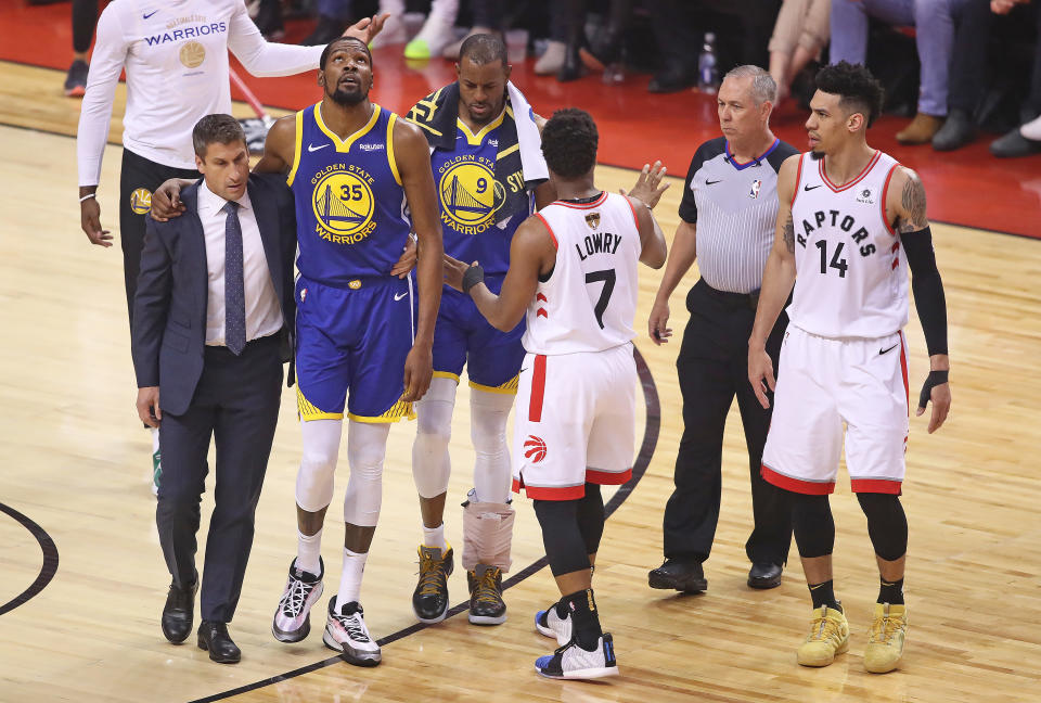 Kyle Lowry of the Toronto Raptors tries to get the crowd to show their respect for an injured Kevin Durant #35 of the Golden State Warriors during Game Five of the 2019 NBA Finals at Scotiabank Arena on June 10, 2019 in Toronto, Canada.