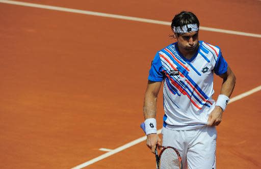 El tenista español David Ferrer resopla durante el partido de segunda ronda ante el ruso Teymuraz Gabashvili en el torneo Conde de Godó en Barcelona, el 23 de abril de 2014 (AFP | Josep Lago)