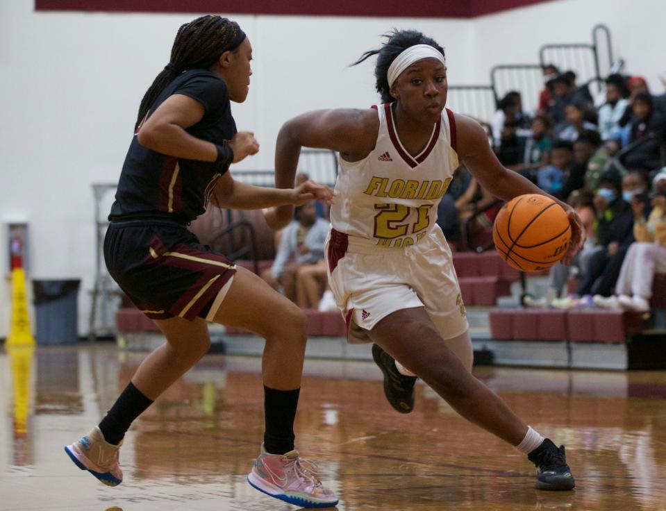 Florida High senior Audia Young (21) drives to the hoop in a game against Wekiva on Jan. 21, 2022 at Florida High. The Seminoles won, 55-45.